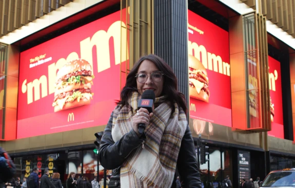 Girl holding Mcdonald's branded microphone